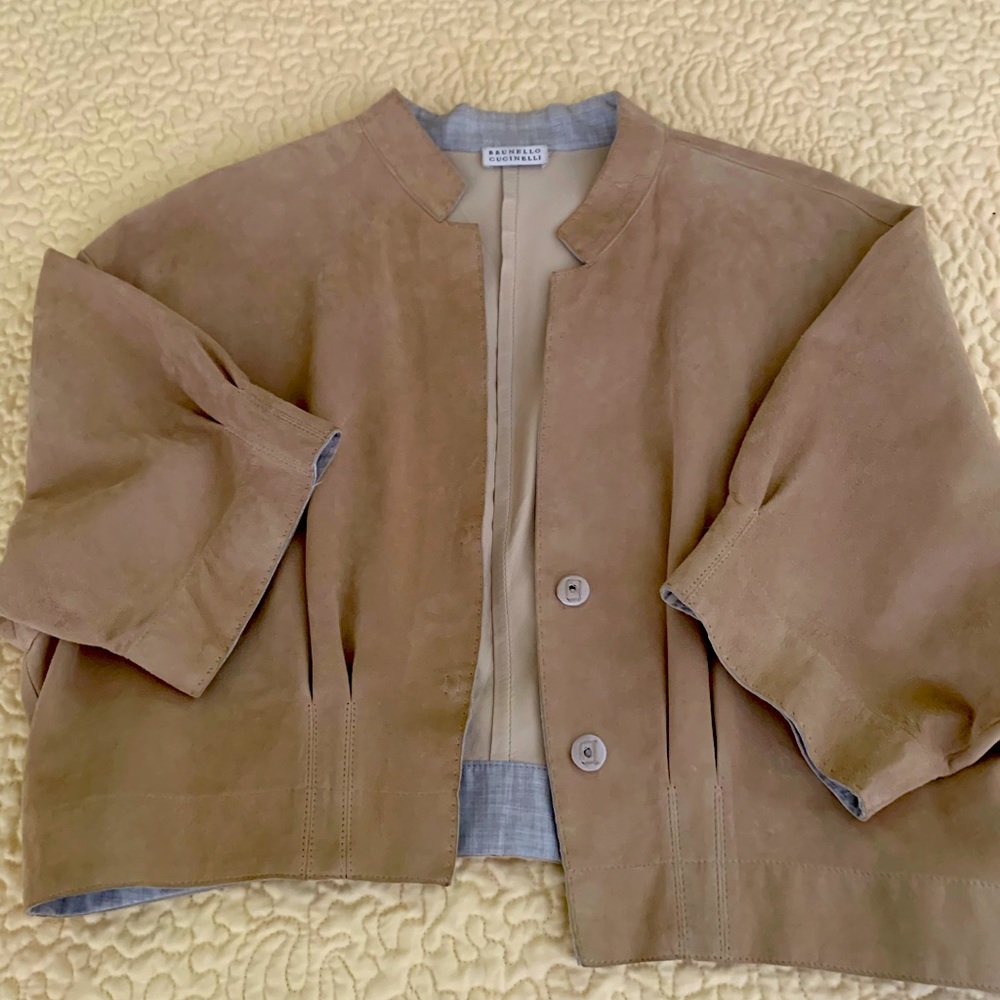 Brunello Cucinelli unlined leather bolero length short sleeve jacket.